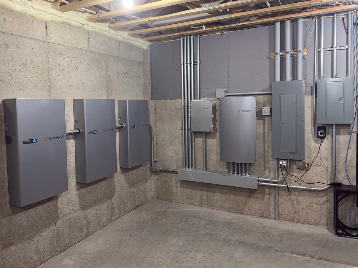 Battery bank and system controller installed in a Wisconsin basement by Sevens Solar