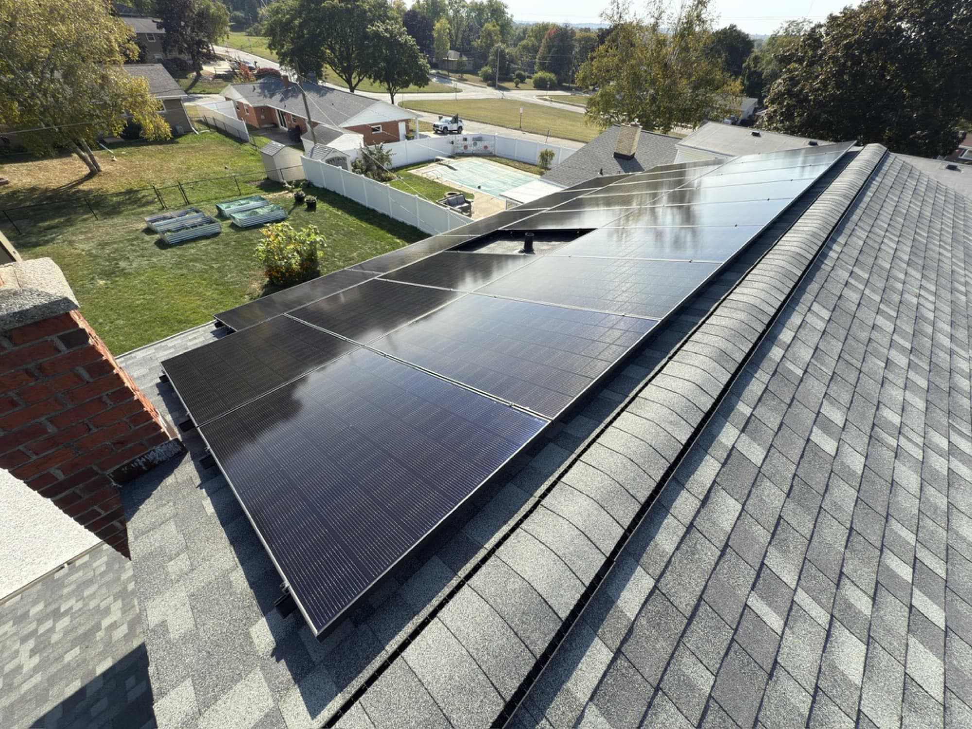 Rooftop view of an all-black solar array on a Green Bay, Wisconsin home